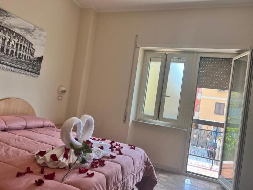 a bedroom with a bed with roses on it at Palazzo Sant'Antonio in Rome