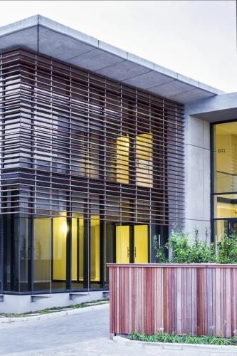 a building with large windows and a fence in front of it at Royal St. Andrews Hotel, Spa and Conference Centre in Port Alfred