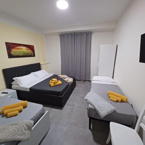 Postel nebo postele na pokoji v ubytování ACRONE GUEST HOUSE Centro Città (Locazione Turistica)