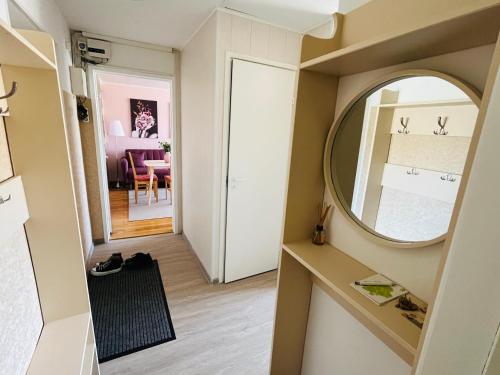 a small room with a mirror and a hallway at Maria Apartment at Rootsi street in Kuressaare