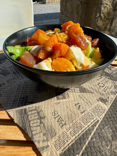 a bowl of food sitting on top of a table at Camping Fonts del Algar in Callosa de Ensarriá