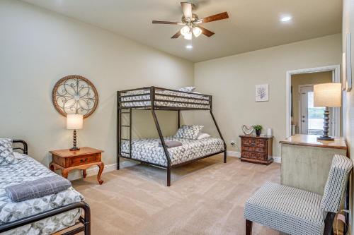 a bedroom with two beds and a ceiling fan at Family-Friendly Alvarado Lake Home with Kayak, Canoe in Alvarado