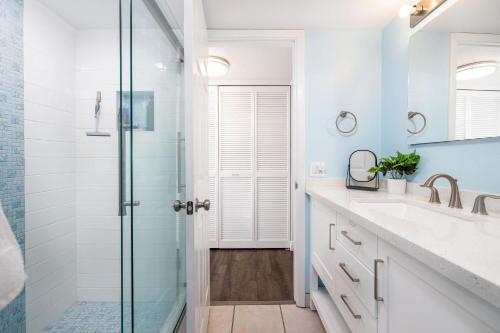 a bathroom with a shower and a sink at White Sands Village#231 in Kailua-Kona