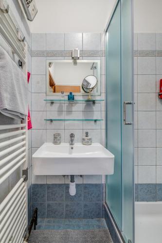 a bathroom with a sink and a shower at Apartment Krilo Jesenice in Krilo