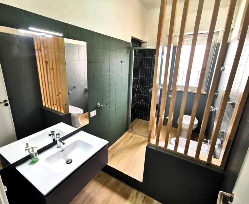 a bathroom with a sink and a shower at Villa Talìa in Marsala