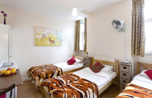 Postel nebo postele na pokoji v ubytování City London Hotel