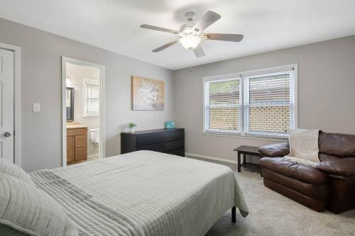 a bedroom with a bed and a ceiling fan at Mesa Manor in Fayetteville
