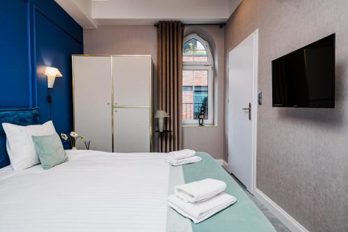 Кровать или кровати в номере Focus Premium Apartments by Focus Hotels
