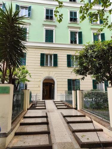 a building with a bunch of steps in front of it at Le dimore di Megollo - Free Parking in Genova