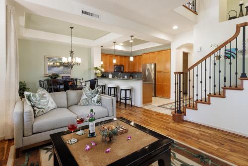 a living room with a couch and a table at Fairways at Mauna Lani #203 in Waikoloa