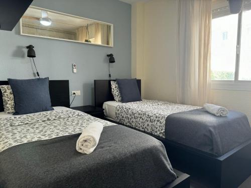 Säng eller sängar i ett rum på Penthouse Apartment, Riviera Del Sol