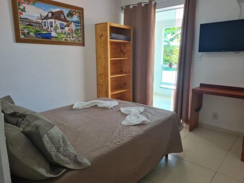 Postel nebo postele na pokoji v ubytování Pousada das Orquideas