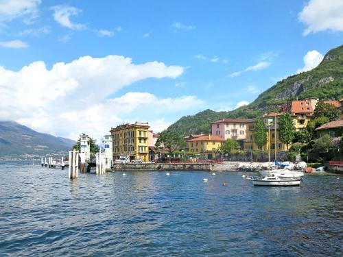 a small town on a lake with boats in the water at Apartment Casa sul Lario by Interhome in Fiumelatte