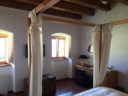 Katil atau katil-katil dalam bilik di Relais Palazzo Lodron