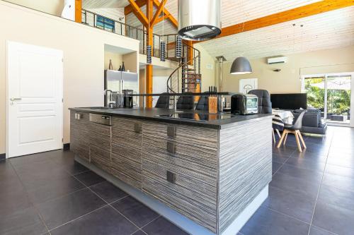 a kitchen with a large counter in a room at Villa Blanche - Moliets Et Maa in Moliets-et-Maa