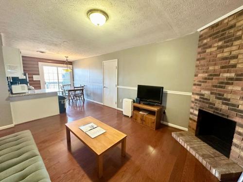 a living room with a couch and a fireplace at Cottage 10 Lees Ford Marina in Nancy