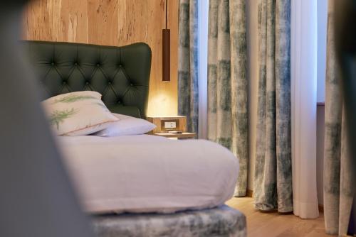 Кровать или кровати в номере Dolada Boutique Hotel