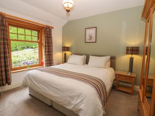 Llit o llits en una habitació de Plum Tree Cottage