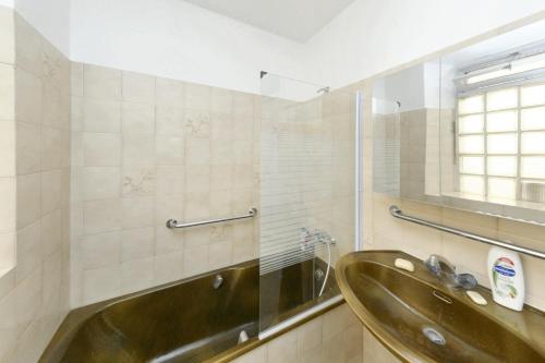 a bathroom with a sink and a mirror at Maison de 3 chambres avec balcon et wifi a Aspres sur Buech in Aspres-sur-Buëch