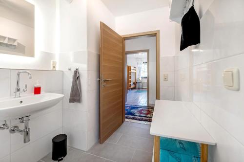 a bathroom with a sink and a toilet and a mirror at Rheinferien in Kamp-Bornhofen