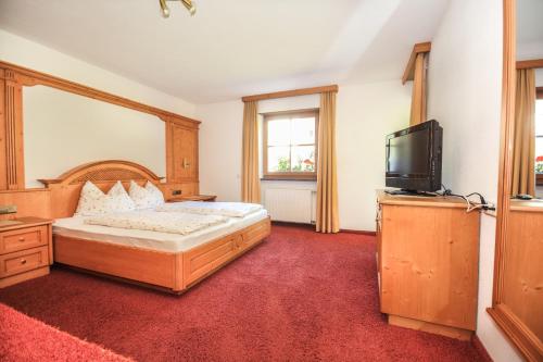 Postel nebo postele na pokoji v ubytování Alpinchalet Ortler