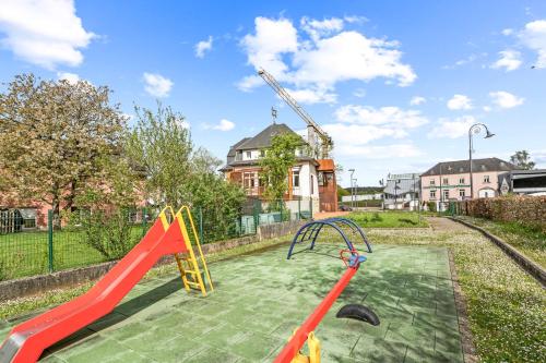 a play area with a slide and a slide at Lénger Schoul in Bascharage