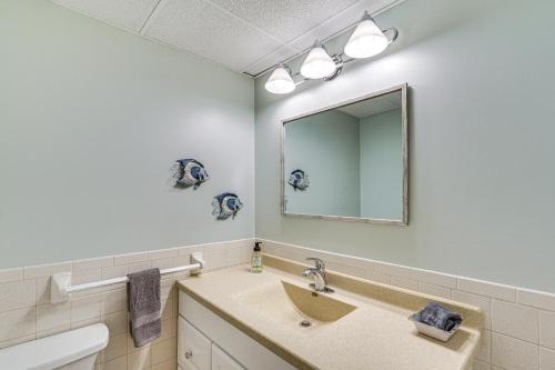 a bathroom with a sink and a mirror at Private Dock and Deck Waterfront Camdenton Home! in Camdenton