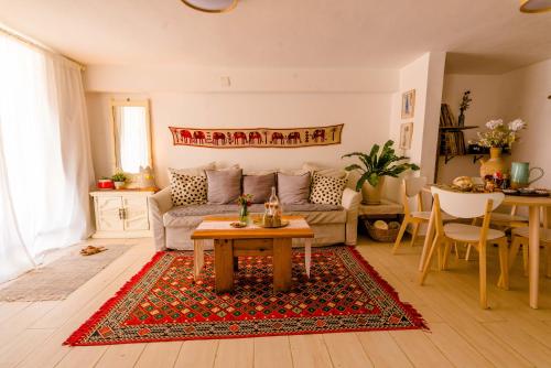 a living room with a couch and a table at Cactus - צימר במדבר in Arad