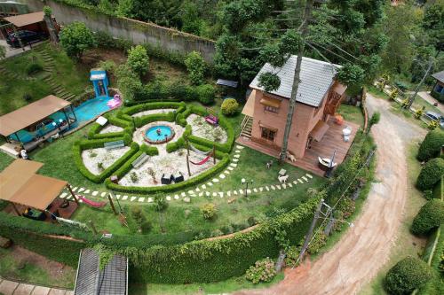an aerial view of a miniature garden with a house at Vila husky pousada in Campos do Jordão