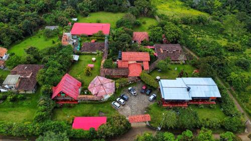 an aerial view of a house with red roofs at Hotel Alto de los Andaquies in San Agustín