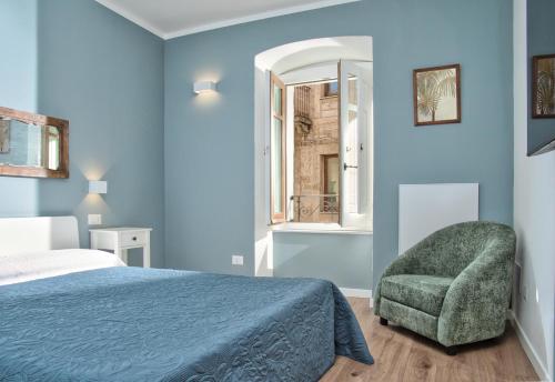 Postel nebo postele na pokoji v ubytování Suite In Piazzetta