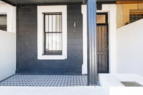 a front door of a house with a window at Lovely and Spacious 2-bedroom home in Norwood in Adelaide