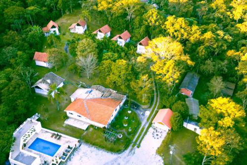 an aerial view of a house with an orange roof at VELINN Pousada Highland in Santo Antônio do Pinhal