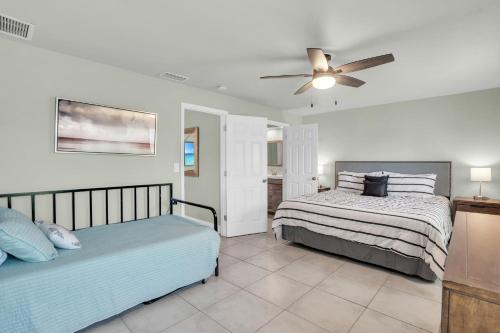 a bedroom with two beds and a ceiling fan at Naples Single Family Pool Home - Kayak the Gordon River & Be Close to the Beach! in Naples