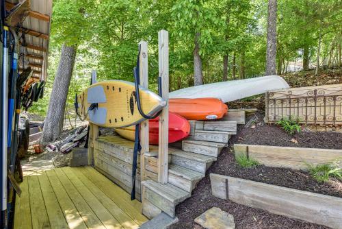 a group of surfboards sitting on some steps at Spacious Home with Deck on Shores of Lake Wylie in York