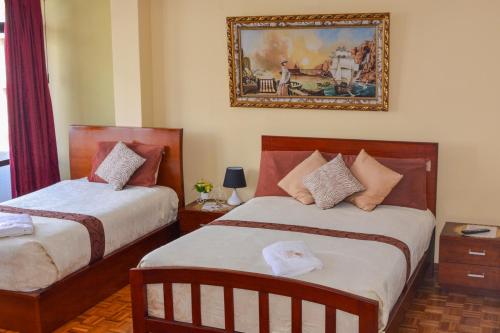 Postel nebo postele na pokoji v ubytování Hotel Villa Lafayette