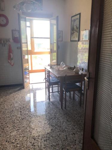 a dining room with a table and some chairs at La Primula Vicinanza 5 Terre in Riccò del Golfo di Spezia