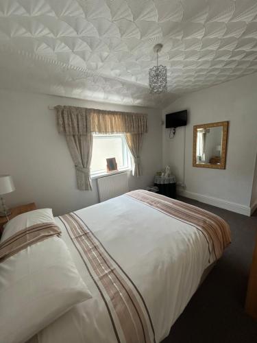 Ένα ή περισσότερα κρεβάτια σε δωμάτιο στο Bayona Guest House
