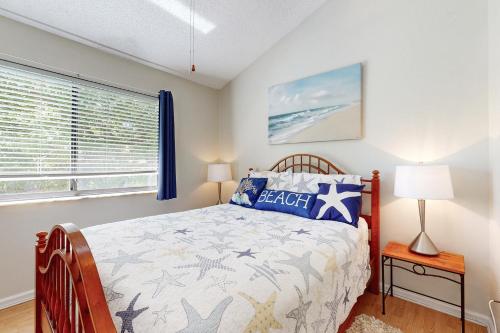 a bedroom with a bed and a window at Forest Ridge 2888 in Fernandina Beach