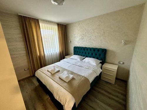 a bedroom with a large bed with two white pillows at Villa Moste 3-Free parking&pool in Ljubljana