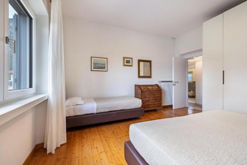 a bedroom with two beds and a window at Tanas in Tenno