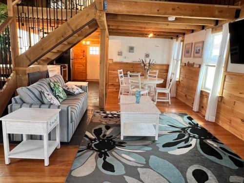 a living room with a couch and a table at Nautical Beach Properties in Hampton