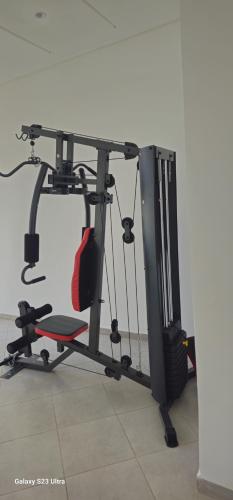 a room with a desk with a chair and a treadmill at Cosy & Confort Studio près de l'aéroport in Nouaceur