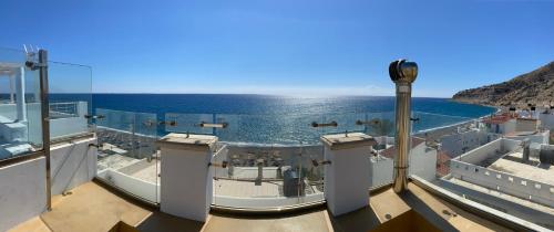 a view of the ocean from the deck of a boat at Blue Horizon Apartment in Myrtos