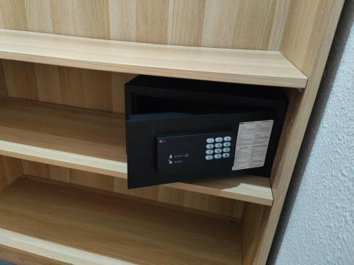 a microwave oven sitting inside of a shelf at Hostal Levante Barcelona in Barcelona
