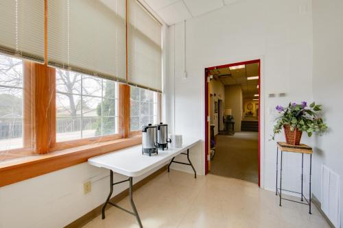 a room with a white table and a window at Pet-Friendly New Kensington Apt with Shared Perks in New Kensington