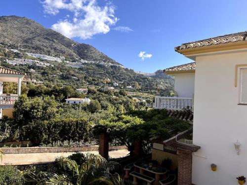 a view of a mountain from a house at Villa Puerto de la Luz in Mijas