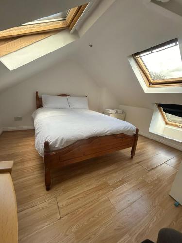 a bedroom with a bed in a room with skylights at Blissful 1-bedroom entire place in Cambridge