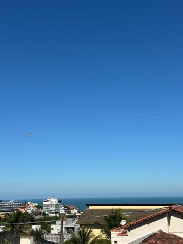 a view of the ocean from the balcony of a building at Casa Iriri in Anchieta