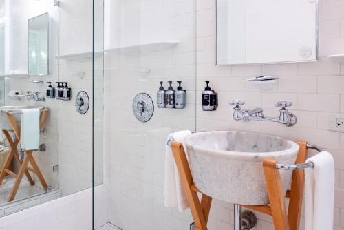 a bathroom with a sink and a shower at The Standard Miami in Miami Beach